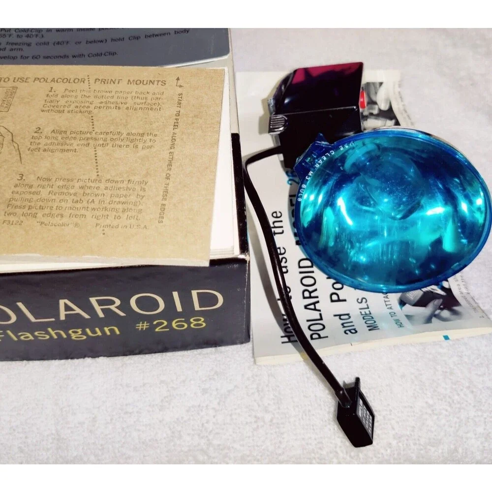 VINTAGE POLAROID FLASHGUN #268 WITH BOX AND MOUNTING POINTS & CLIP